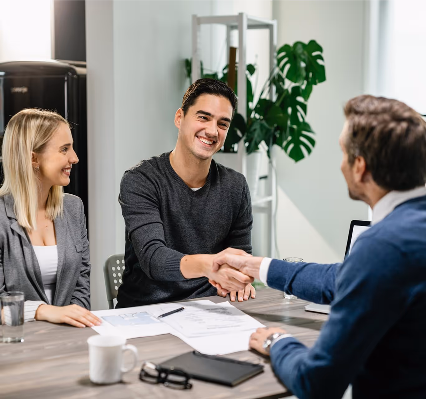 Smiling professional shaking hands during a successful business meeting