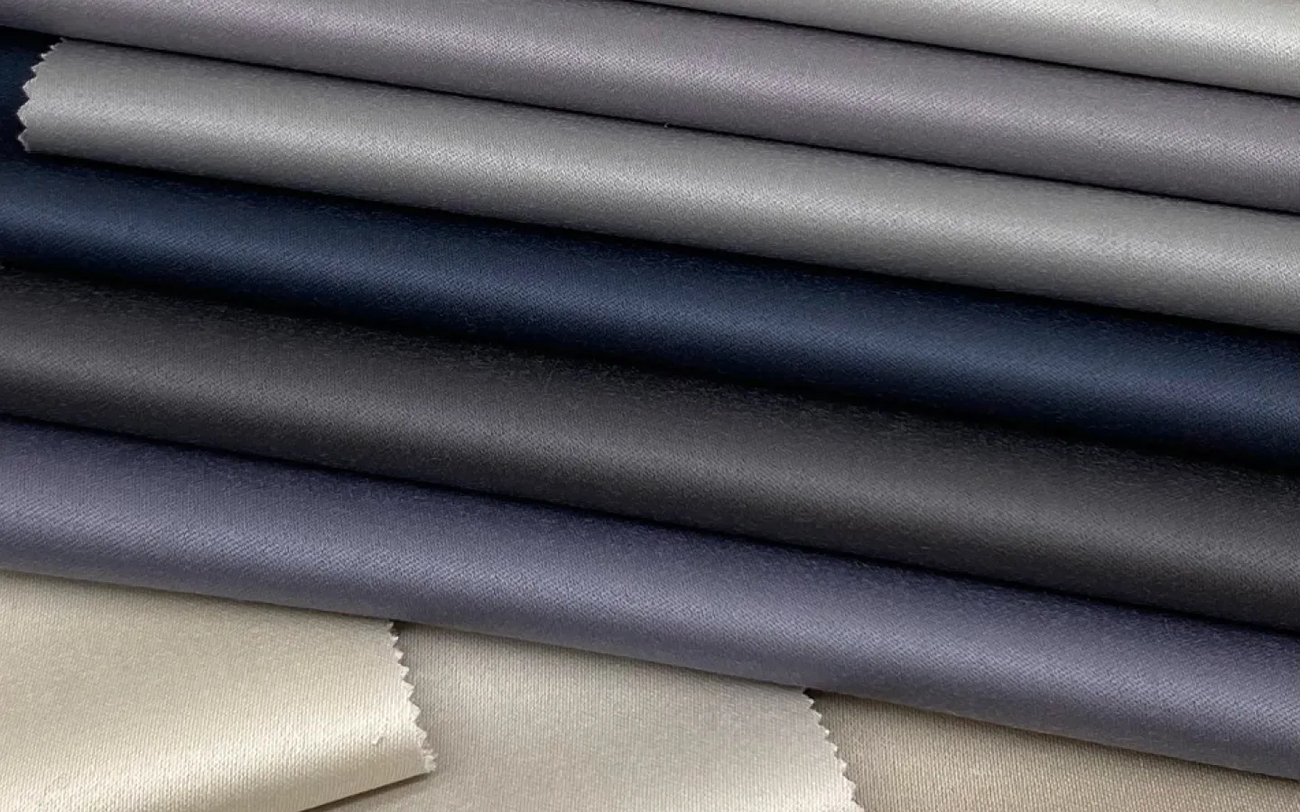 Belgravia striped luxury fabric in navy and cream for interiors.