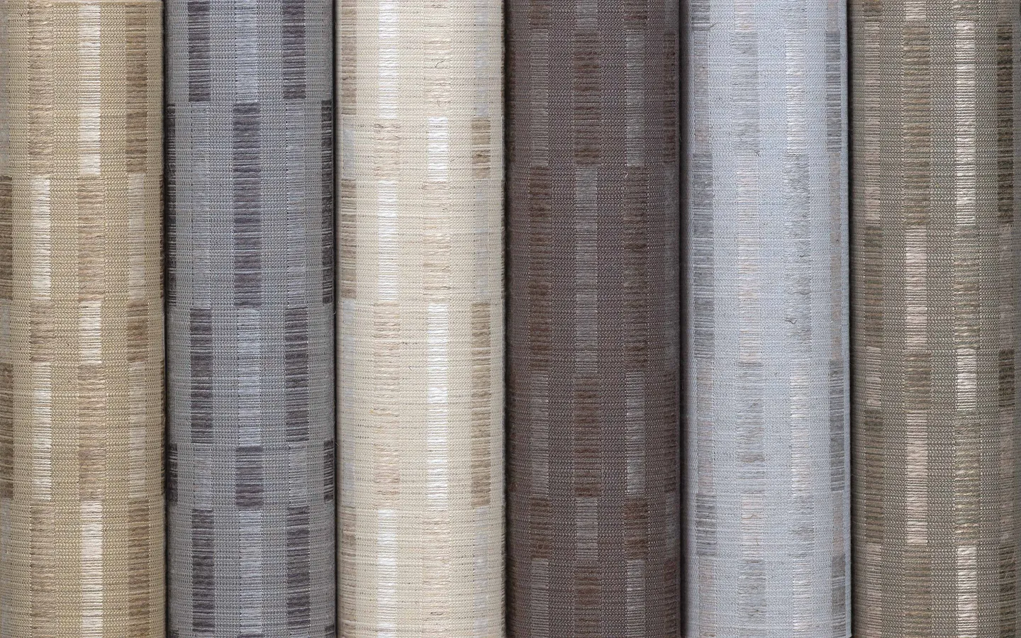 Natural woven wallcoverings with subtle linear pattern in grey hues.