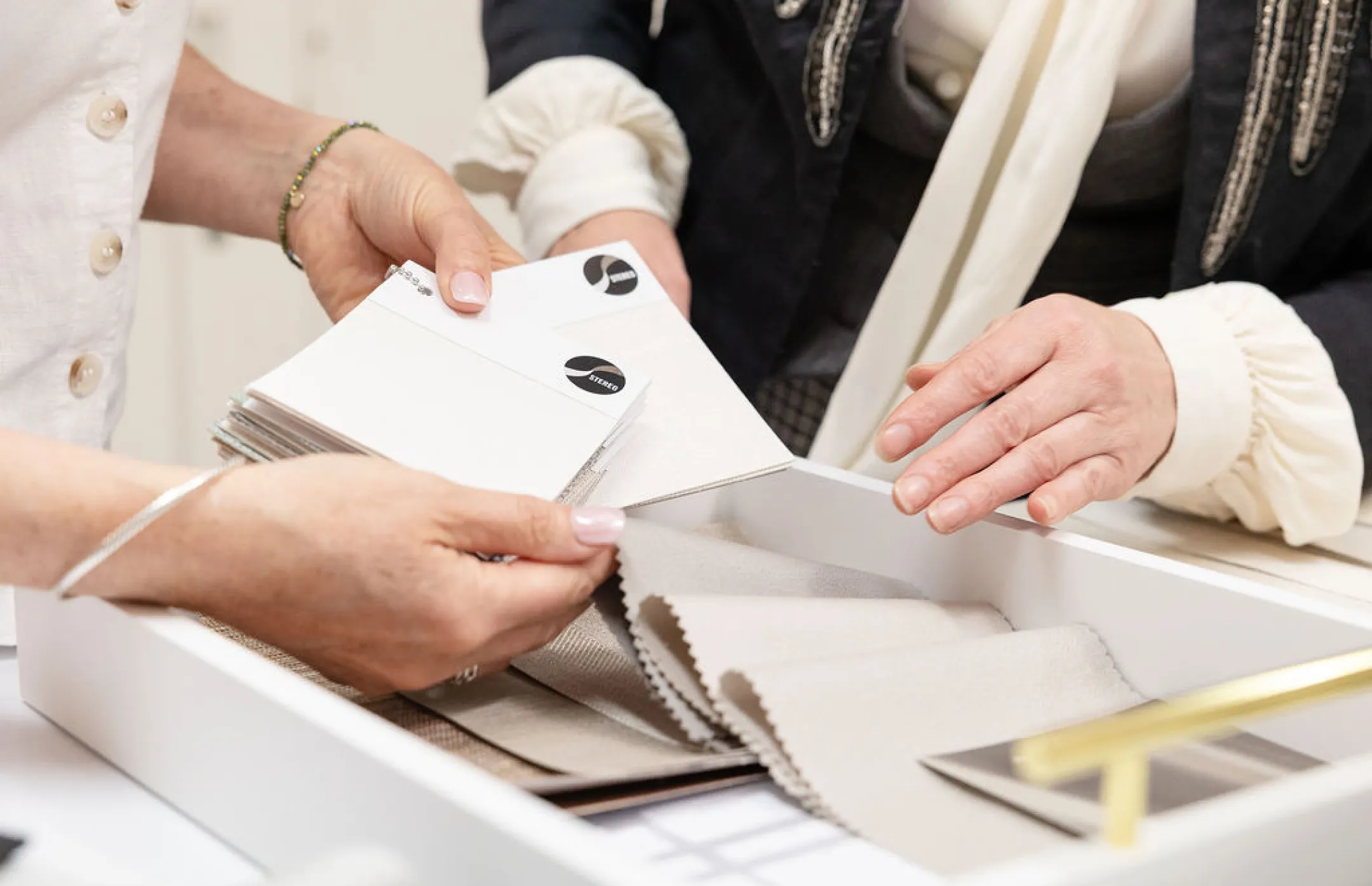 The customer service team viewing fabric and wallcovering samples from Stereo Interiors
