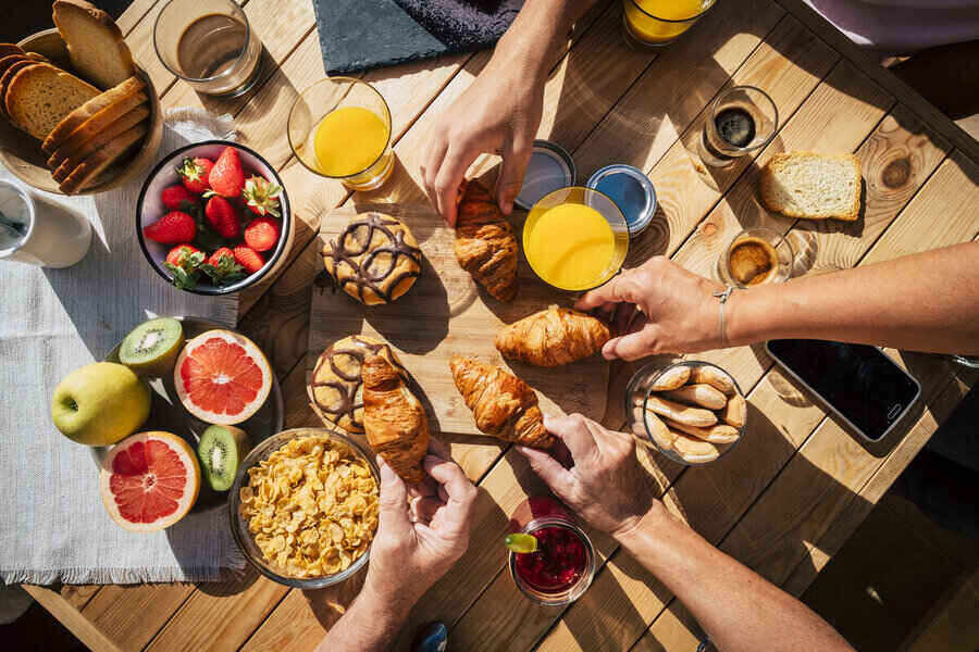 Vertical view of table full of breakfast food for instagram growth