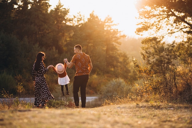 A family enjoying a stroll through the woods