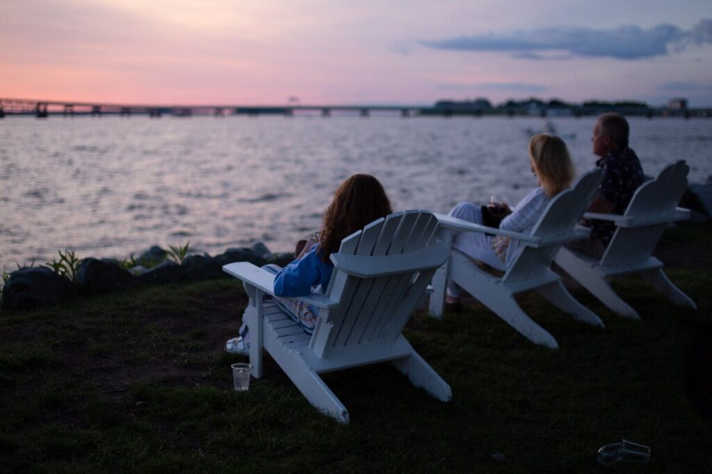 a group of friends relaxing by the sea