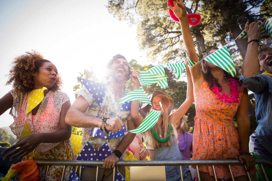 Group of friends dancing at music festival
