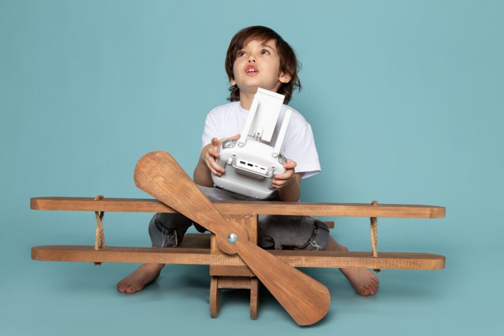 nostalgic childhood memory of a child building a wooden plane