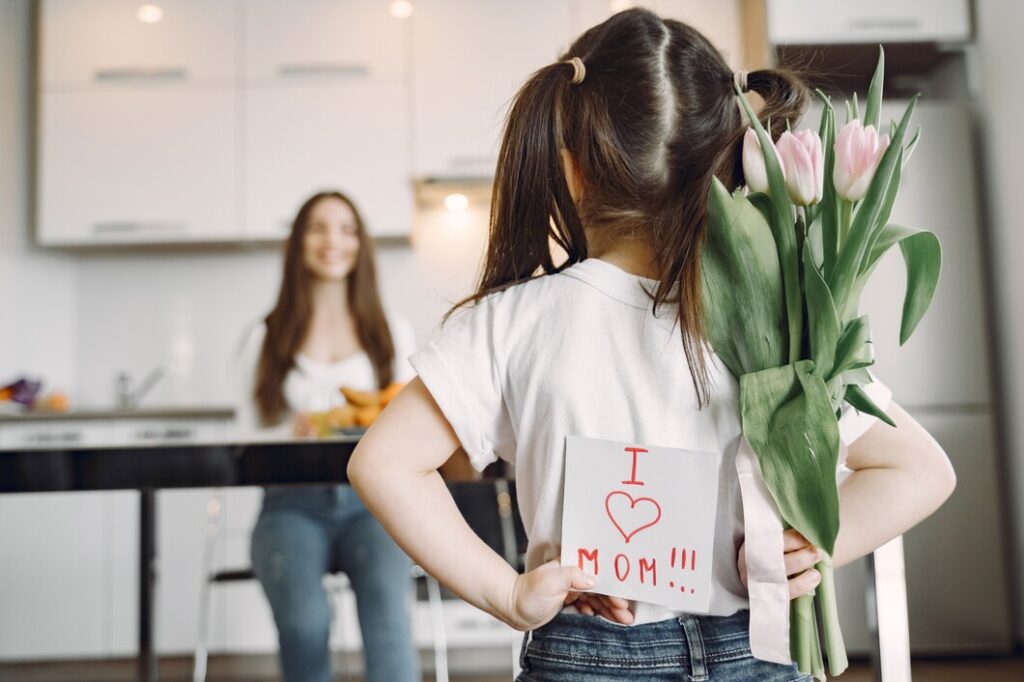 young girl getting ready to congratulate her mom