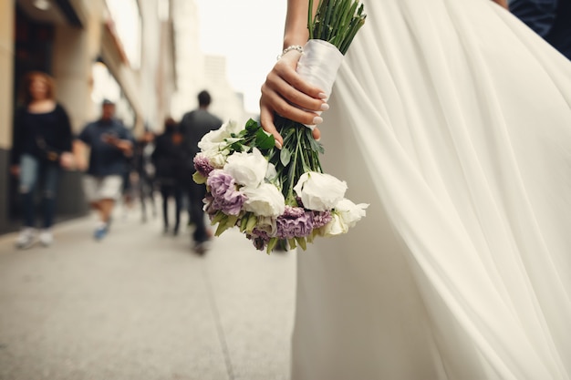 Bride holding a white flower bouquet