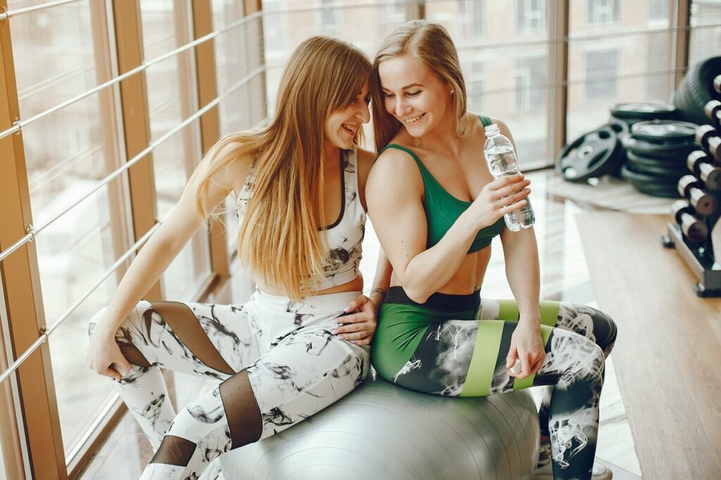 Two women exercising on the weekend at home