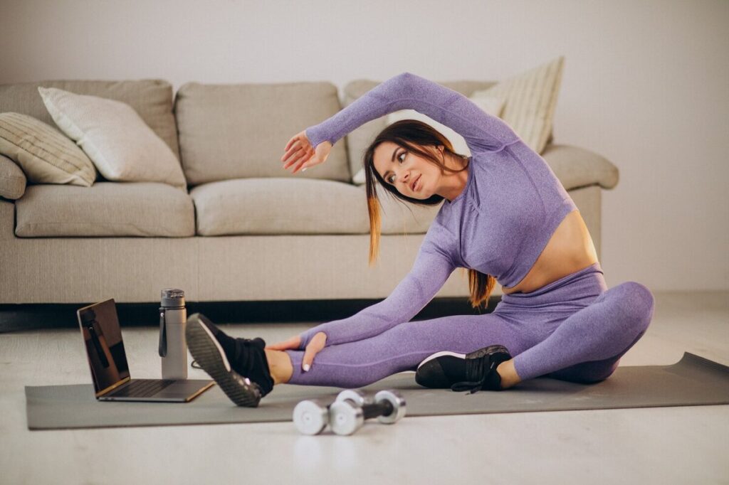 woman doing yoga in her living room for instagram
