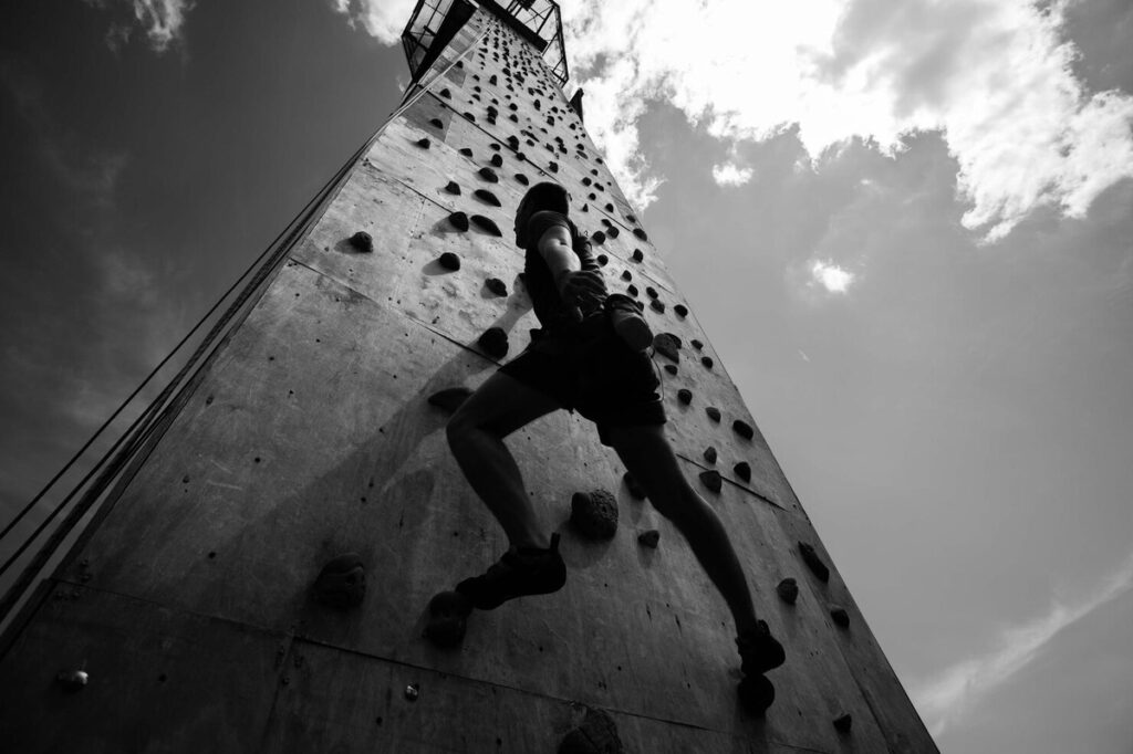 person rock climbing for motivation