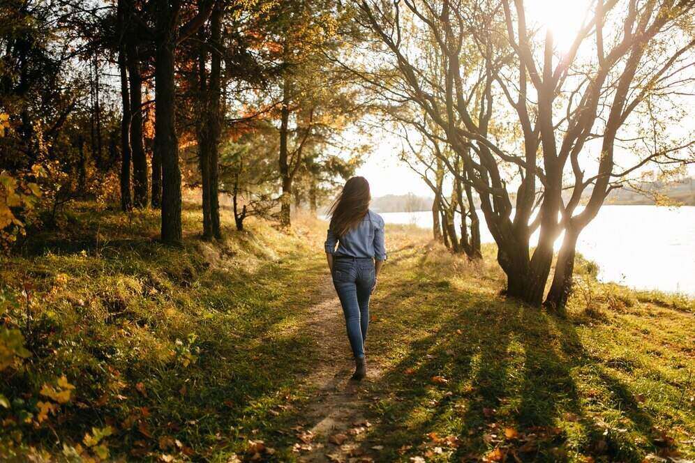 Woman enjoying a walk in the forest