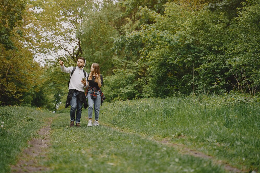couple having nature walk in the woods