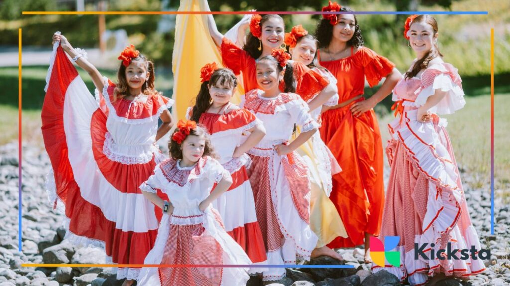 Girls in colorful dresses posing for cultural dance