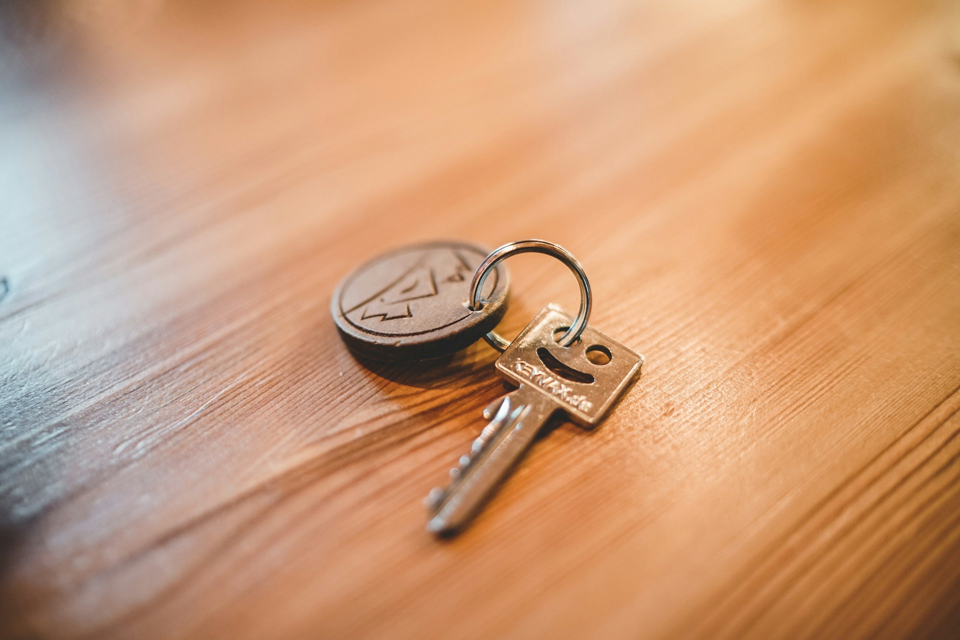 A set of house keys on a timber table