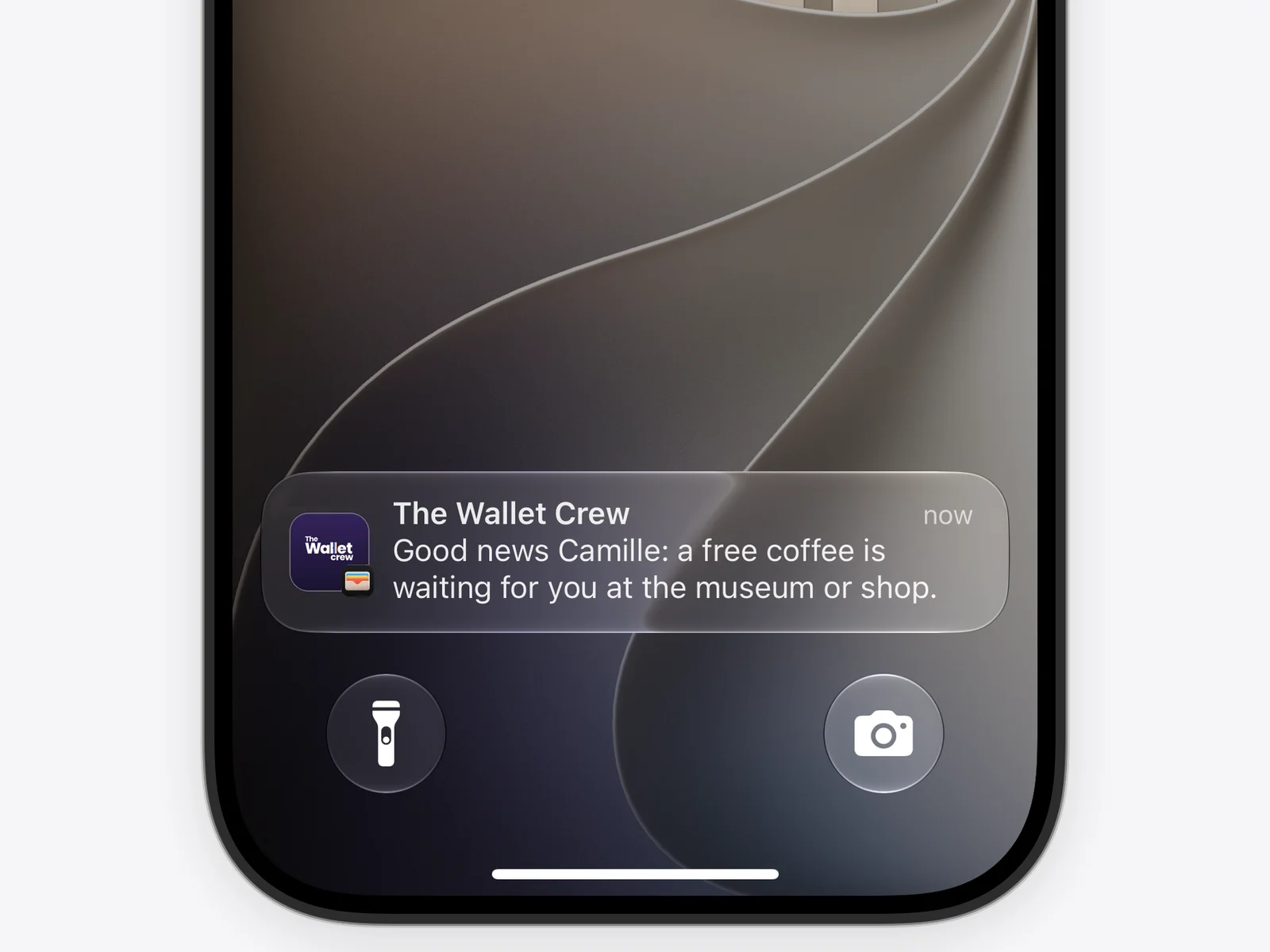 Apple Wallet notification on an iPhone lock screen: a free coffee is waiting at the museum