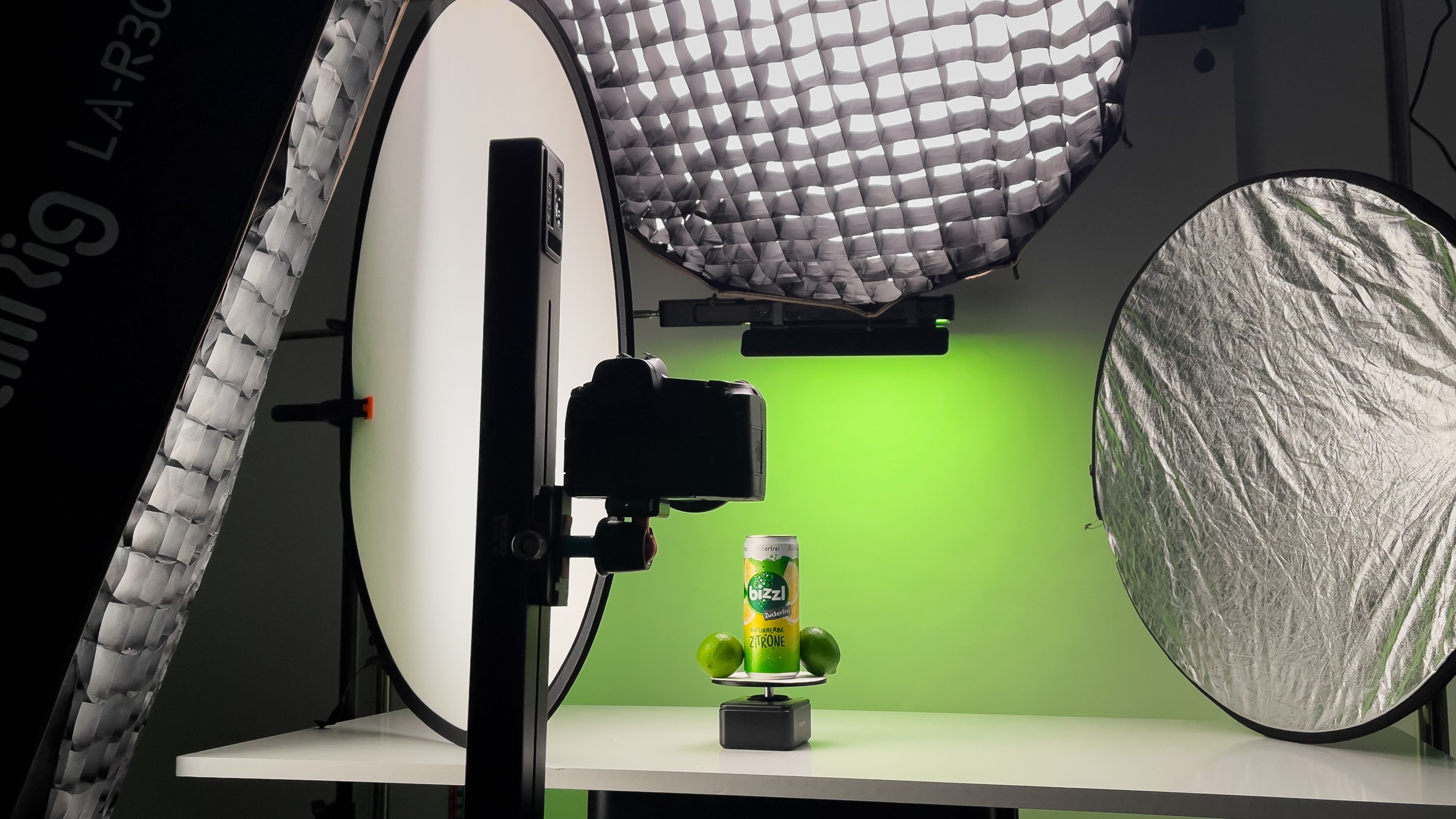 "Creative product development shoot with studio lights and green background"