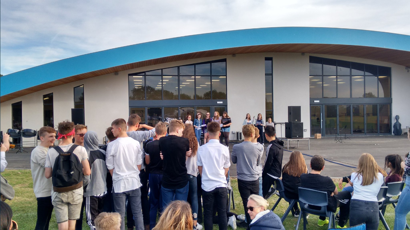 group of students outside new modular built classroom