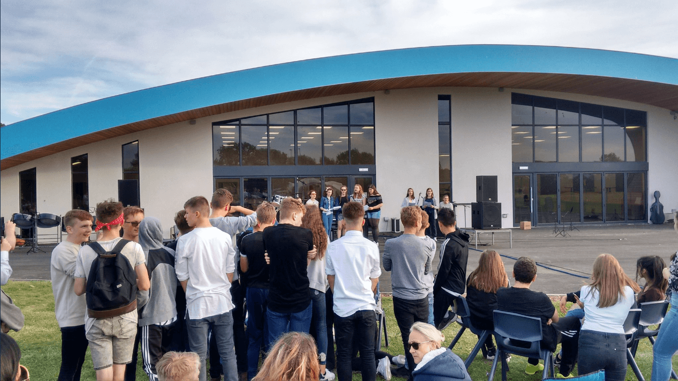 Students gathered for an outdoor event outside the Southam College music academy