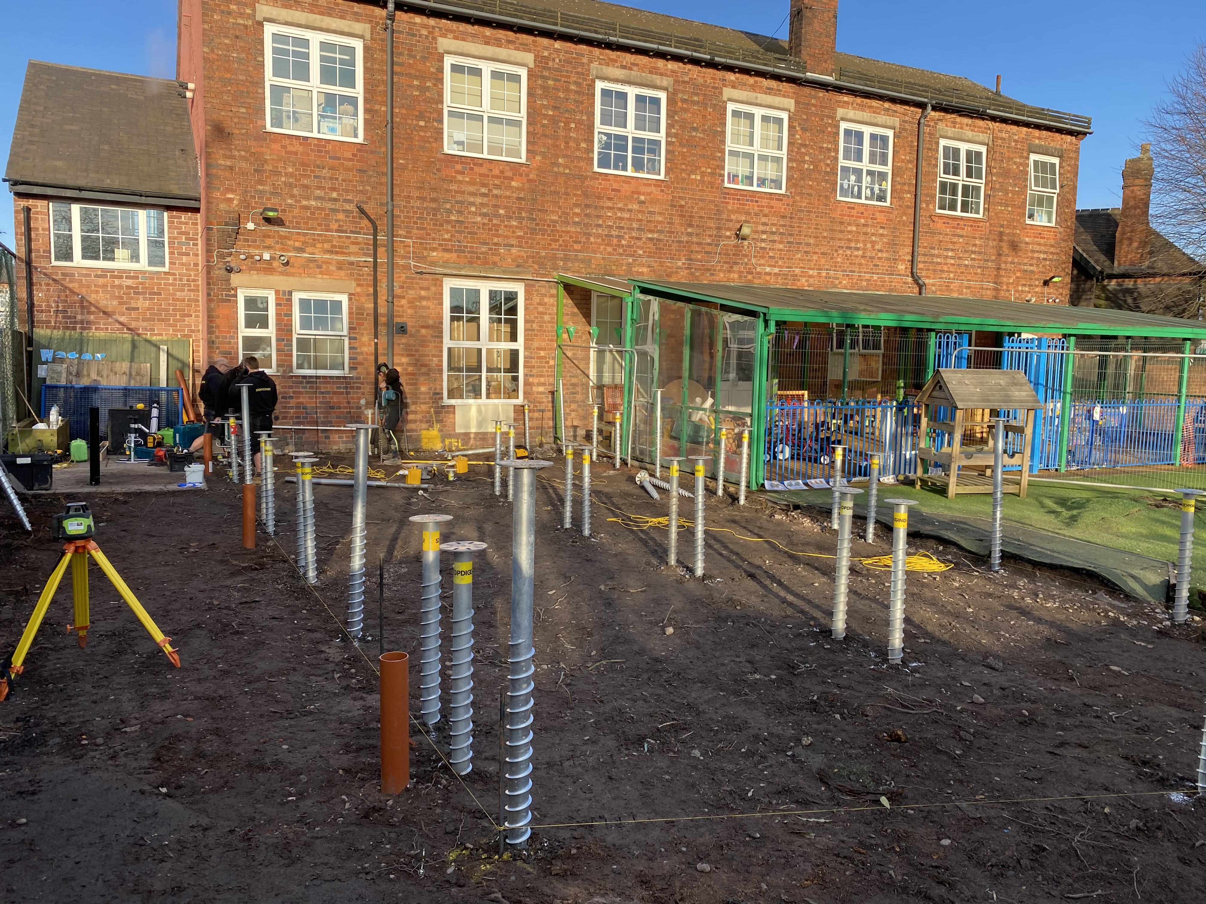 Ground screw foundations installed at a nursery site ahead of a modular build
