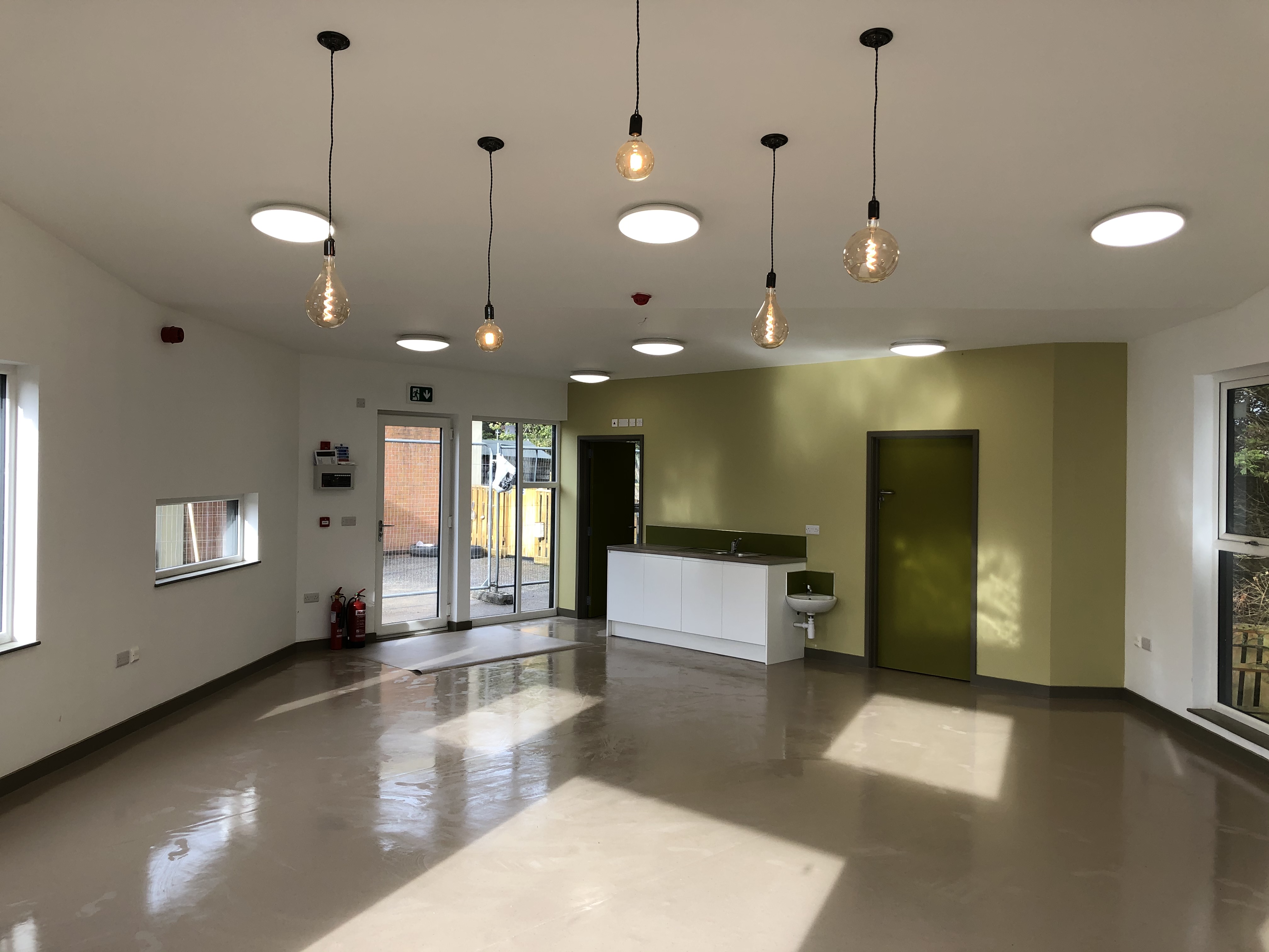 Bright interior of Tops Day Nursery on the Isle of Wight with pendant lights