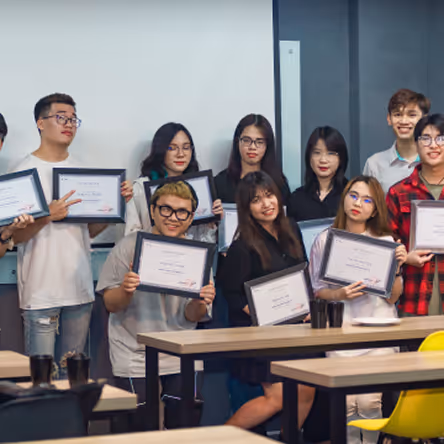 a group of people holding up frames