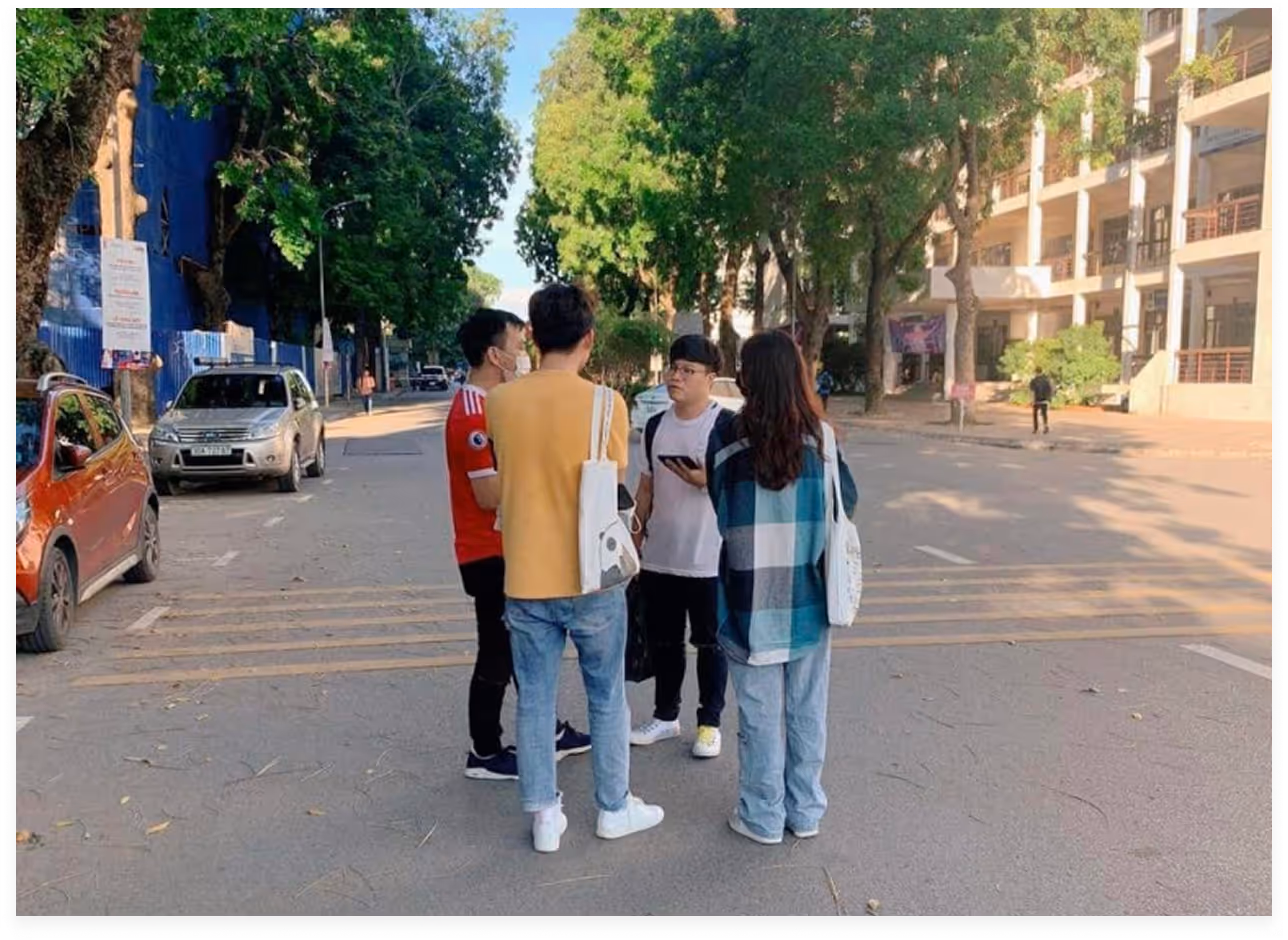 a group of people standing in a street