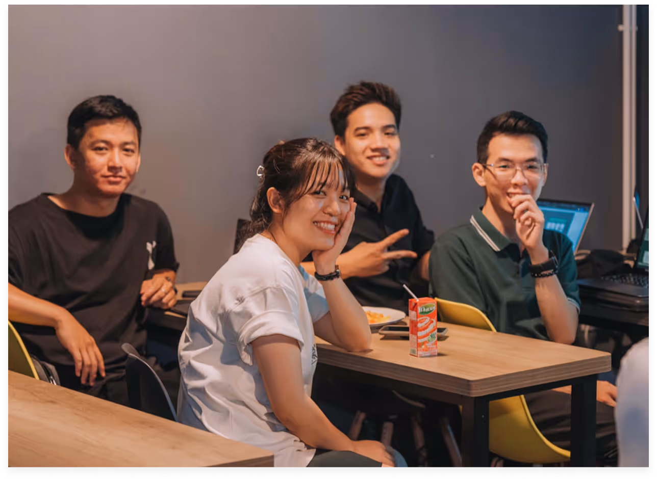 a group of people sitting at tables