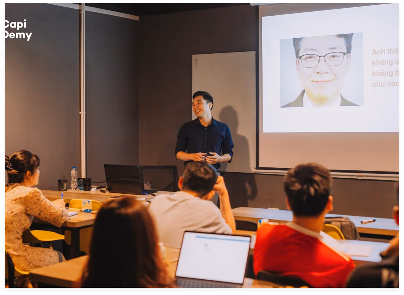 a man standing in front of a screen