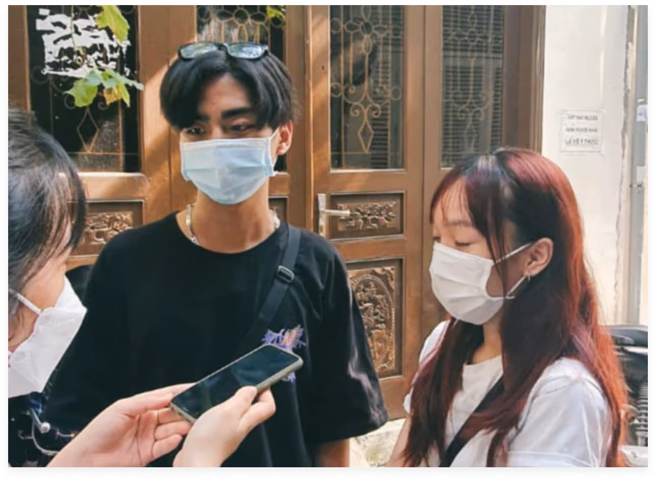 a man and woman wearing face masks