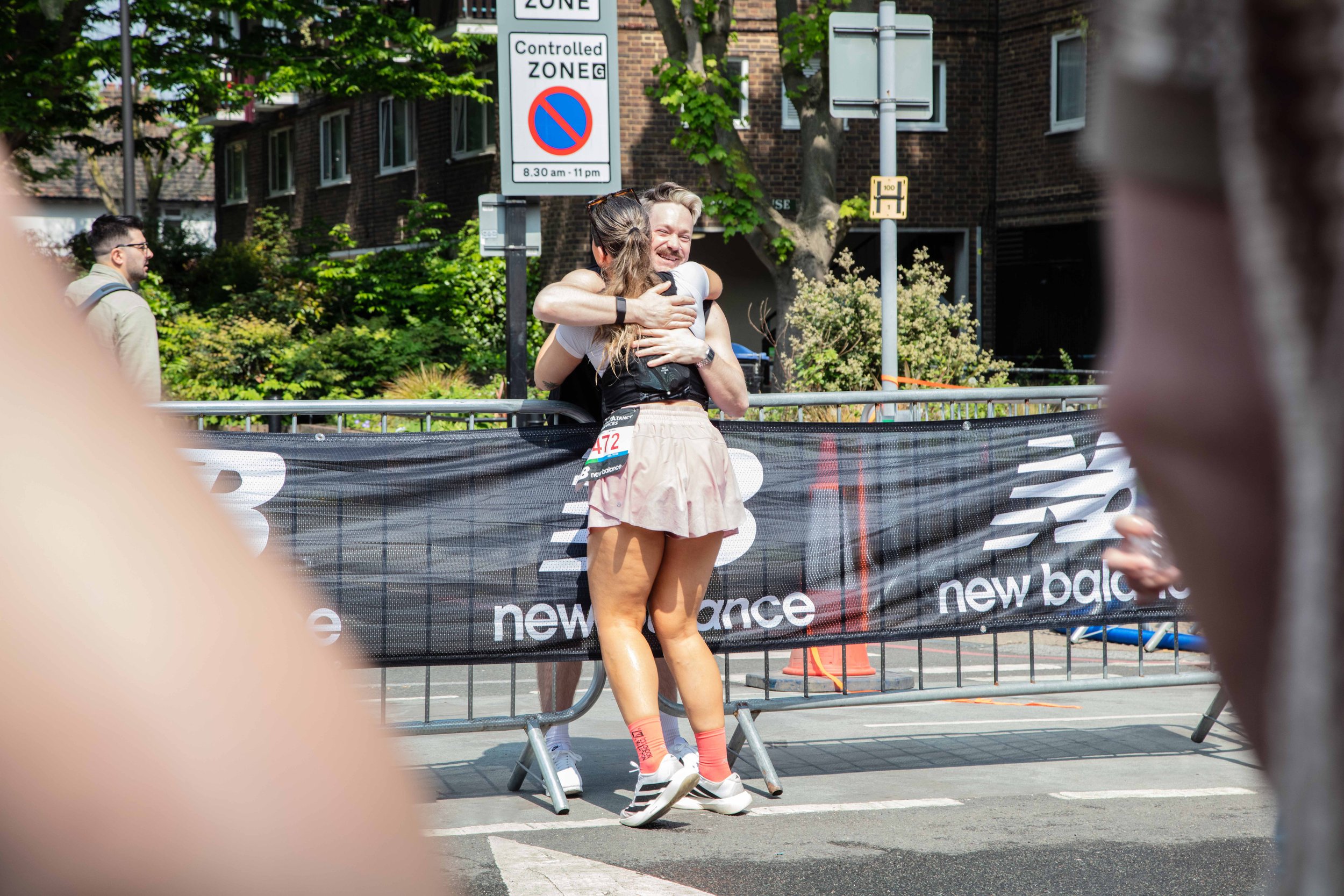 London Marathon Runner Hugging A Supporter