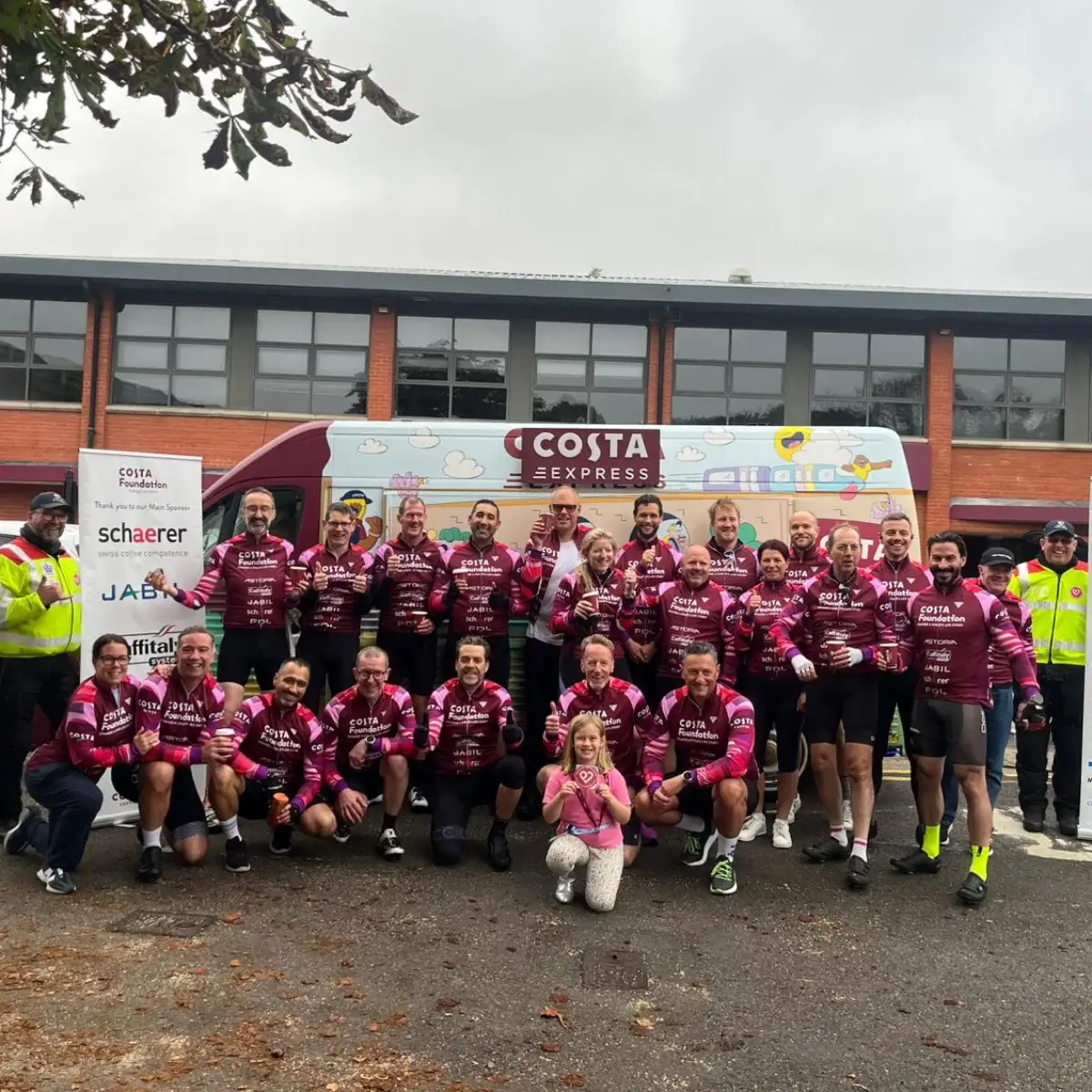 Scoffs team posing for charity run photo
