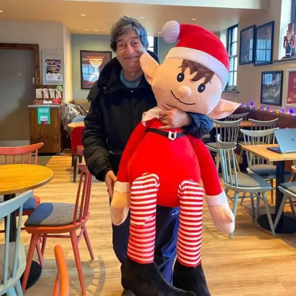 Scoffs team member posing with Christmas elf