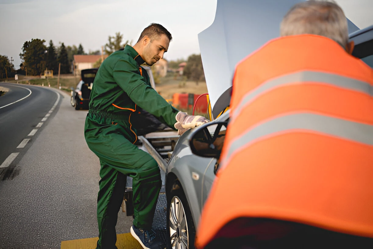 Mechanic assisting with broken down car