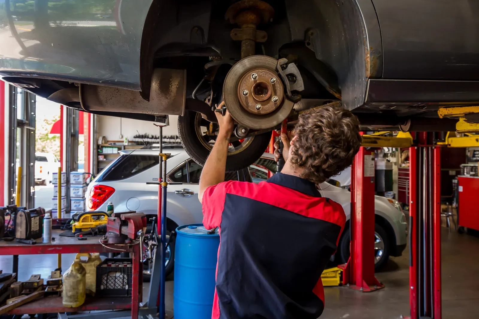 Mechanic inspecting wheel hub