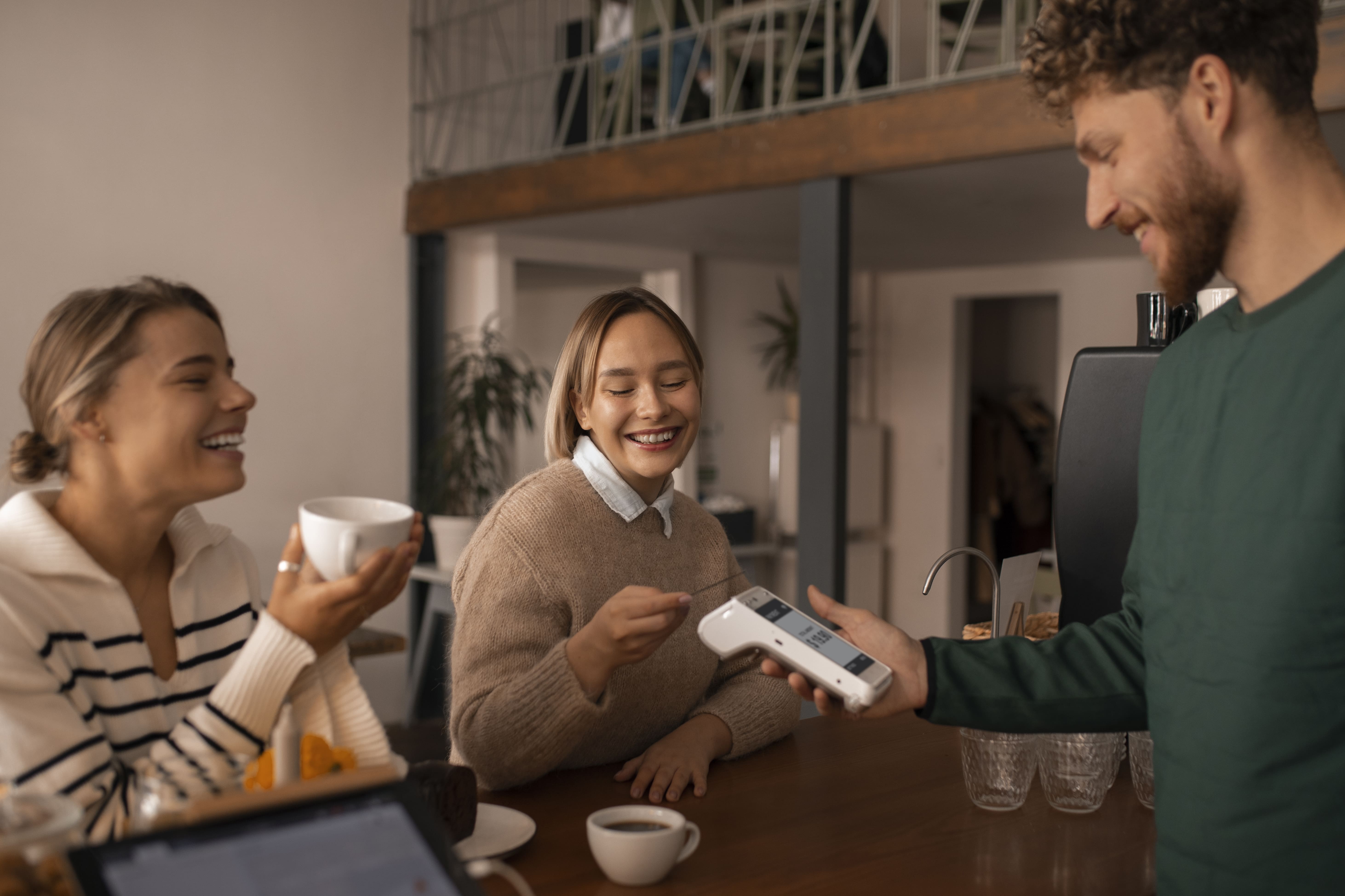 Customer paying by contactless in a restaurant