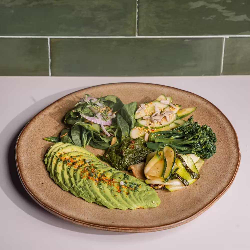 Healthy Greens plate with avocado, baby spinach, cucumber salad, broccolini and zucchini - Brix Cafe Dubai