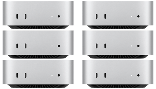 Front view of six Mac mini computers arranged in two rows of three, each showing two USB-C ports, a small white indicator light, and a headphone jack.