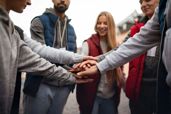 Group of people holding hands