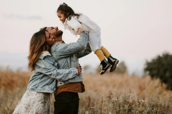 A happy family portrait emphasizing the importance of planning ahead with reproductive carrier screening tests. 