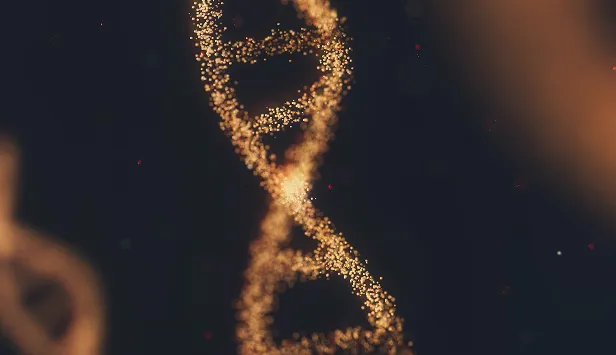 Abstract close-up of a glowing gold DNA double helix structure on a dark background.