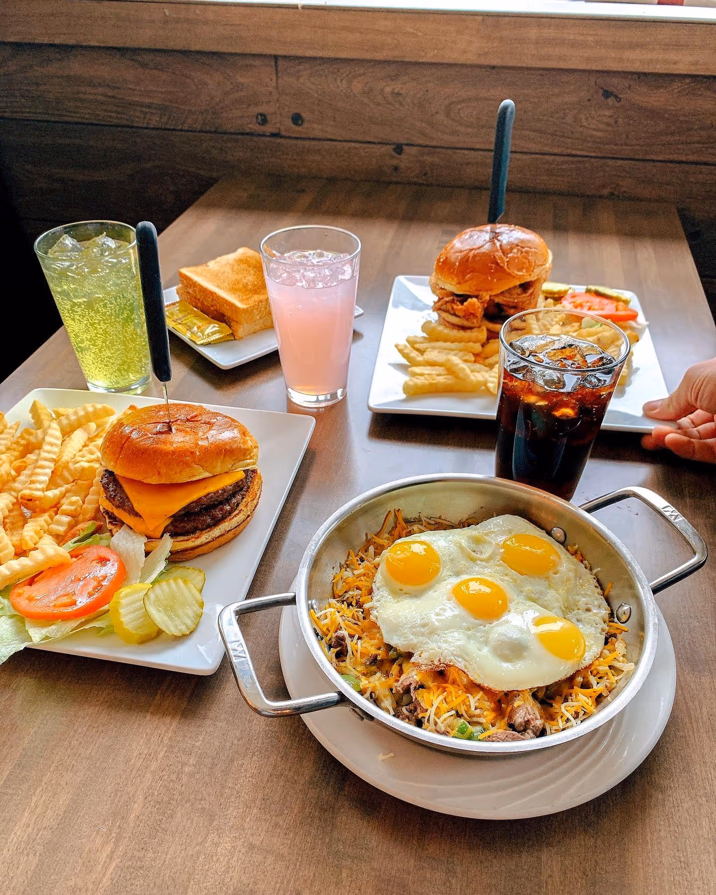 A table with a plate of food and drinks.
