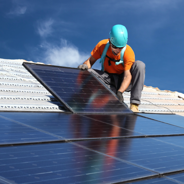Solar panel installation on commercial rooftop by Sunchoice Energy