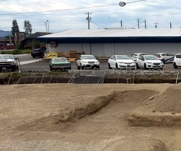 Footing trenches on a commercial lot beside existing buildings in North Idaho