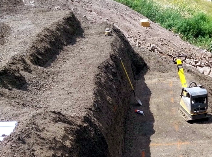 Stepped, benched excavation walls on a North Idaho site