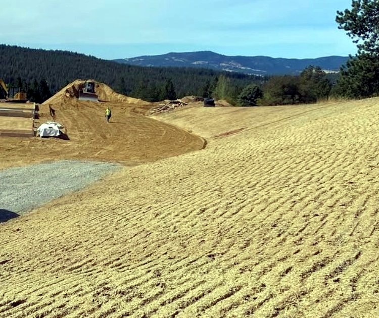 Freshly graded, track-walked ground on a North Idaho site