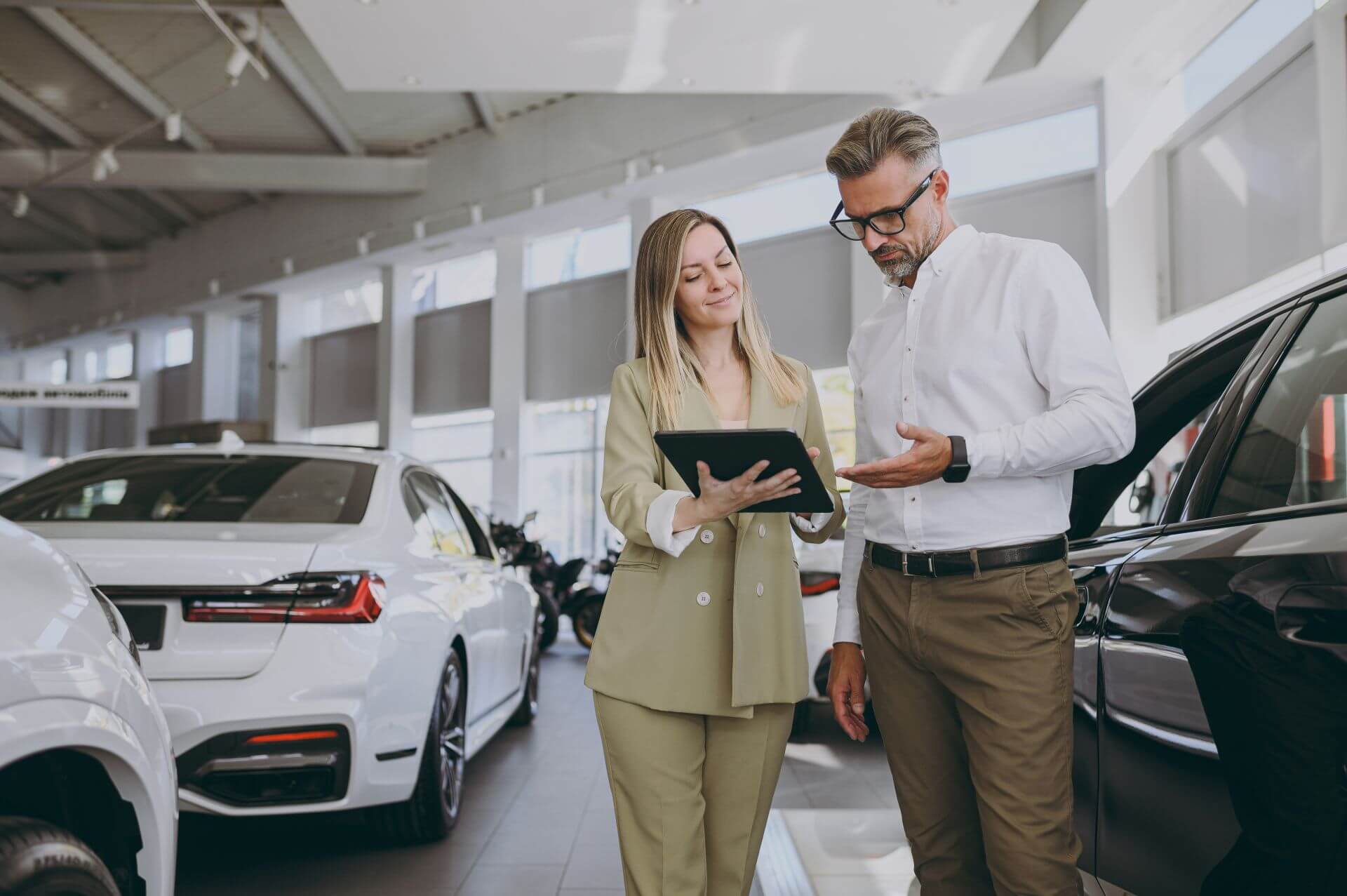 Two adults consulting on car insurance