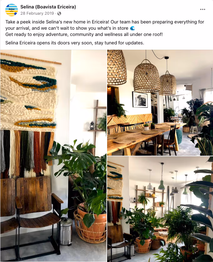 Bright indoor community space with wooden chairs, tables, woven wall art, and many green plants.