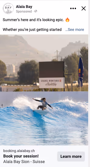 Surfer riding a wave in a clear blue artificial wave pool at Alaïa Bay with mountains in the background.