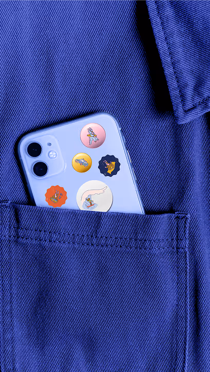 Light purple smartphone with five colorful cartoon stickers inserted in a blue pocket.