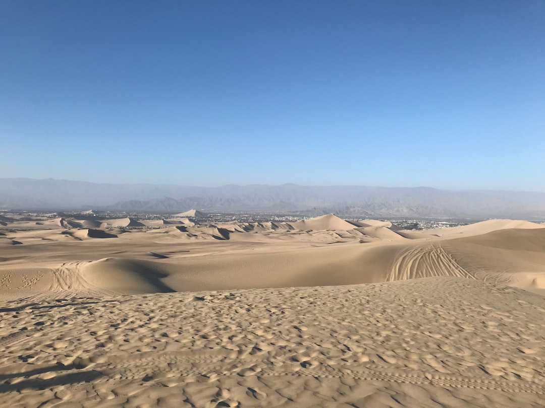 dusty landscape representing San Diego's inland environment - "I need professional solar panel cleaning in San Diego. Who provides this service?"